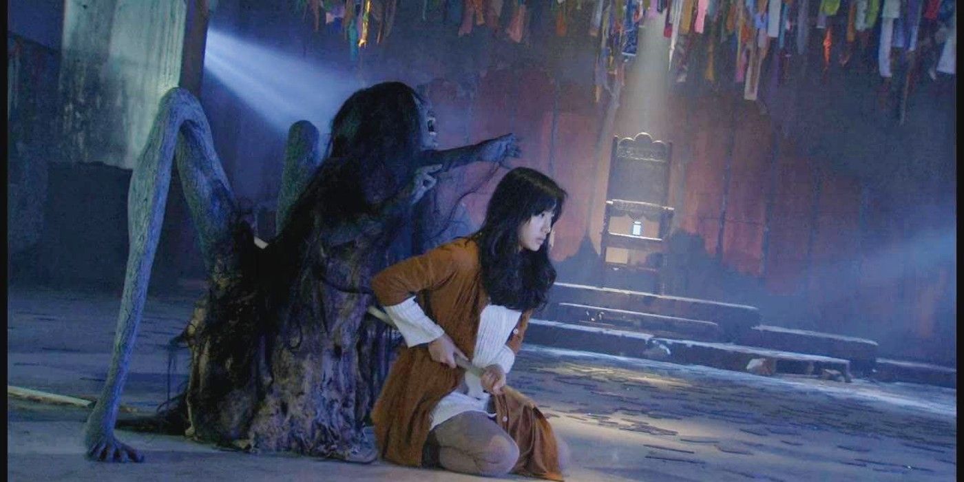A creature standing behind a character in Sadako 3D