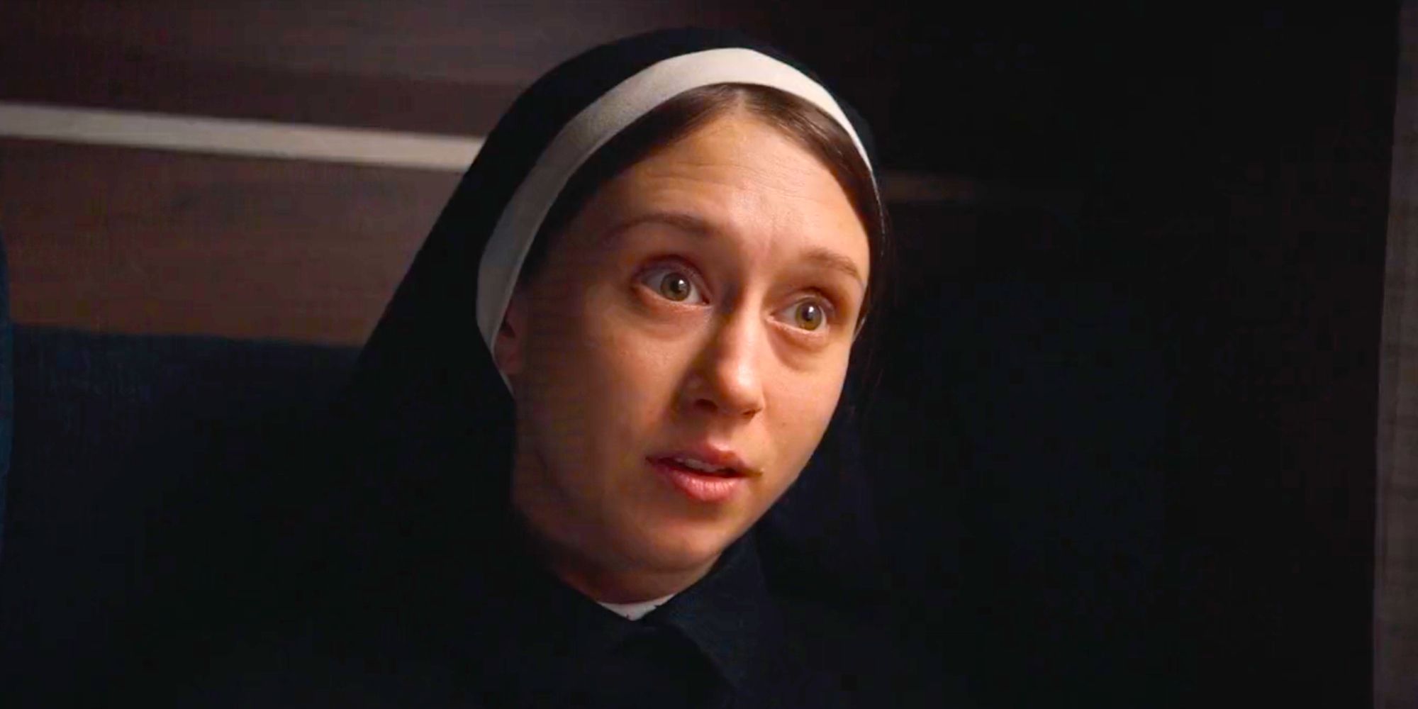 Sister Irene sitting on a train and talking in The Nun 2