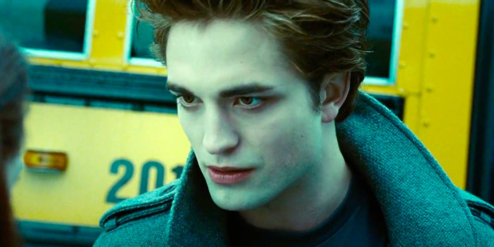 Edward talking in Twilight in front of a school bus