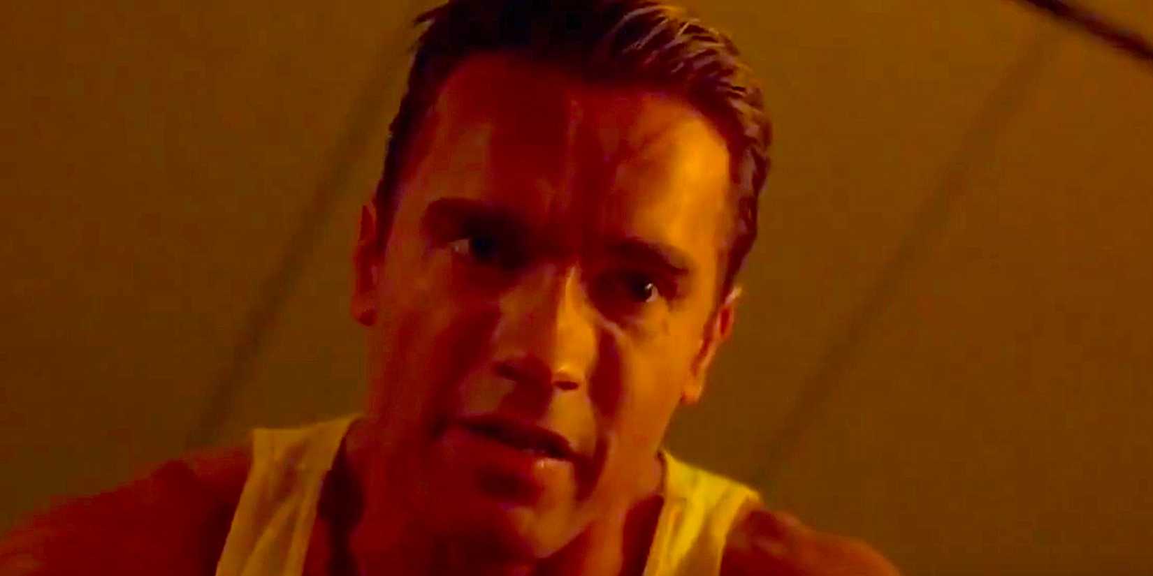 Arnold Schwarzenegger looking down in The Running Man
