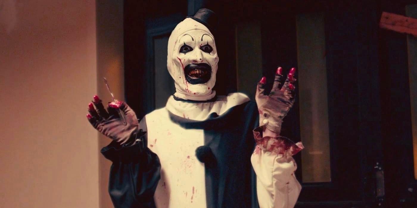 Terrifier's Art the Clown holding up his hands in All Hallow's Eve