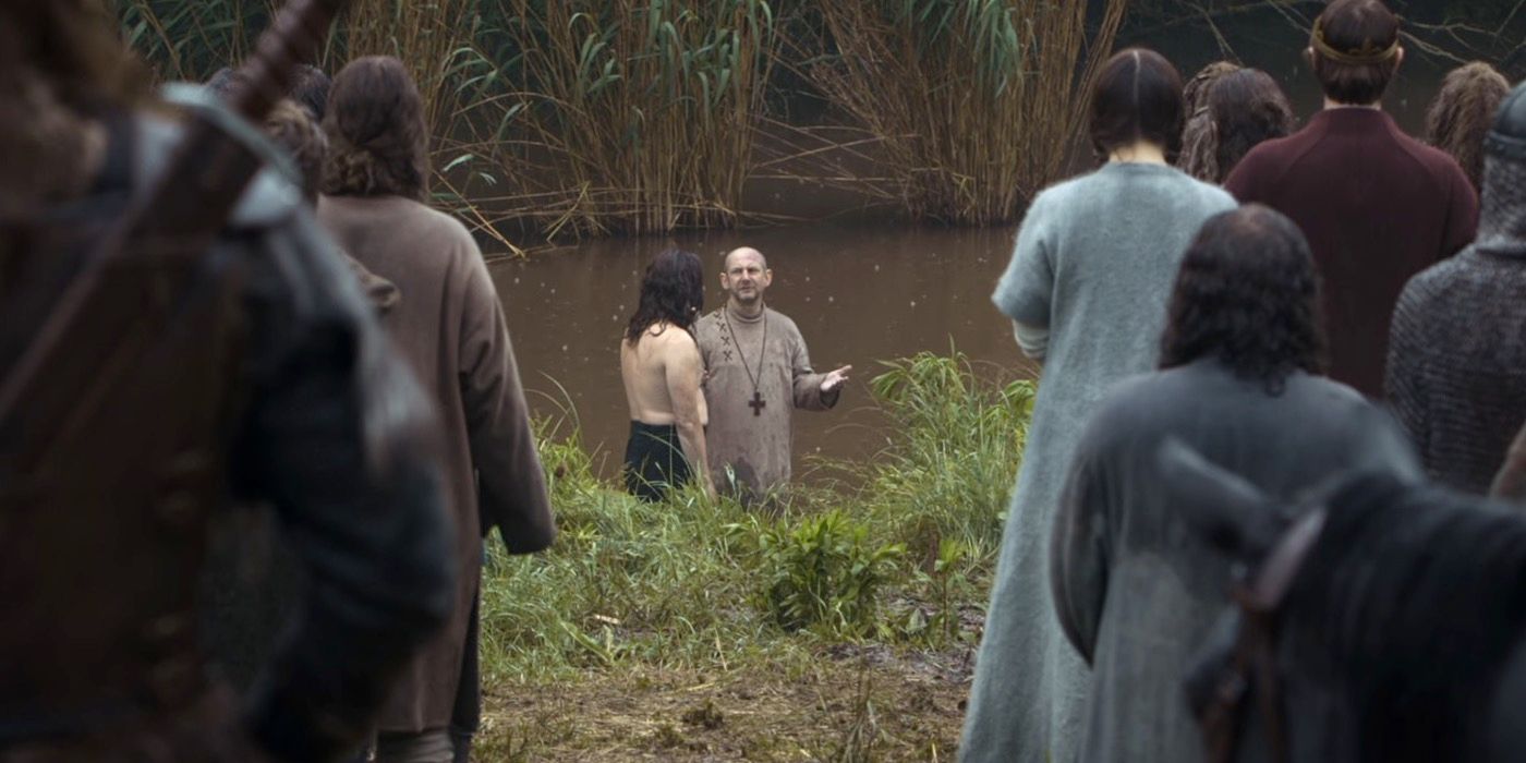 Father Beocca baptizes Guthrum in The Last Kingdom season 1.
