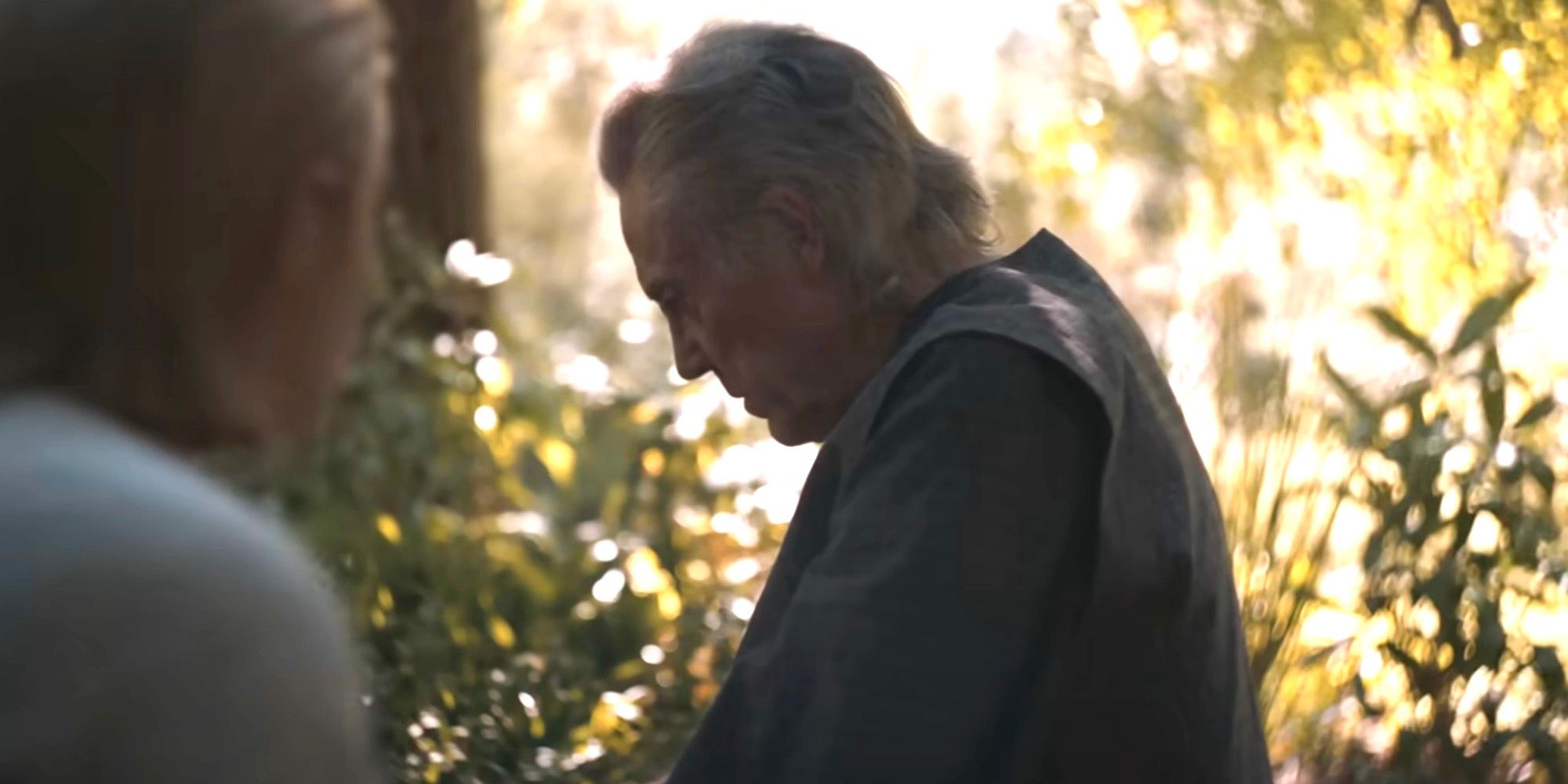 Christopher Walken as Emperor Shaddam IV sitting in a garden in Dune: Part Two.