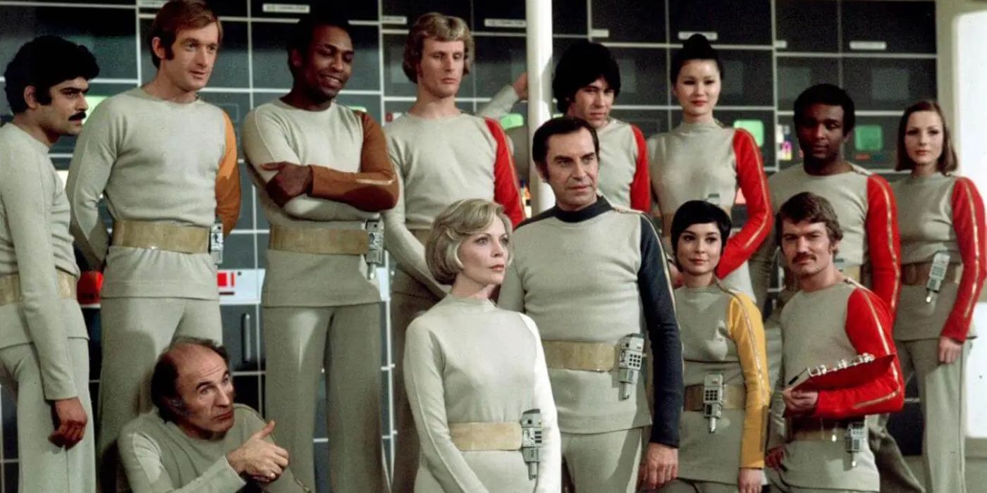 The cast of Space: 1999 standing together in the Moon base
