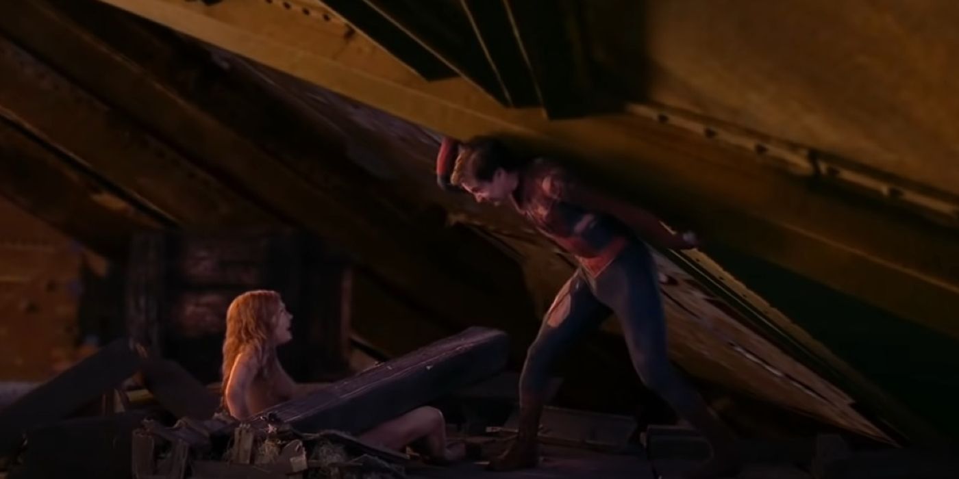 Tobey Maguire's Spider-Man lifting a section of debris to protect MJ in Spider-Man 2