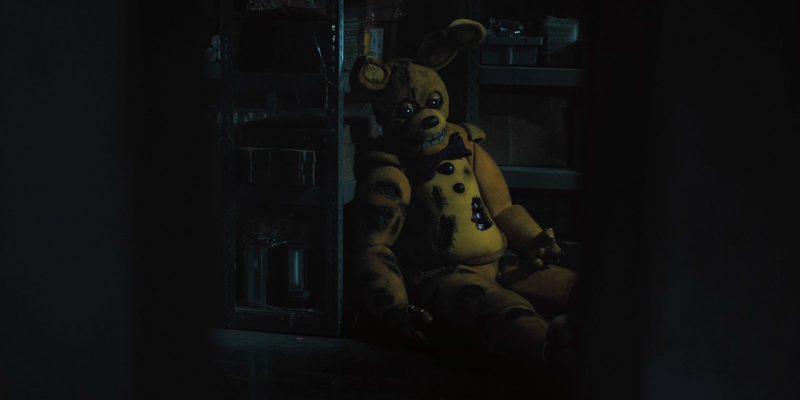 William Afton sits in a storage room in his Spring Bonnie suit after getting springlocked.