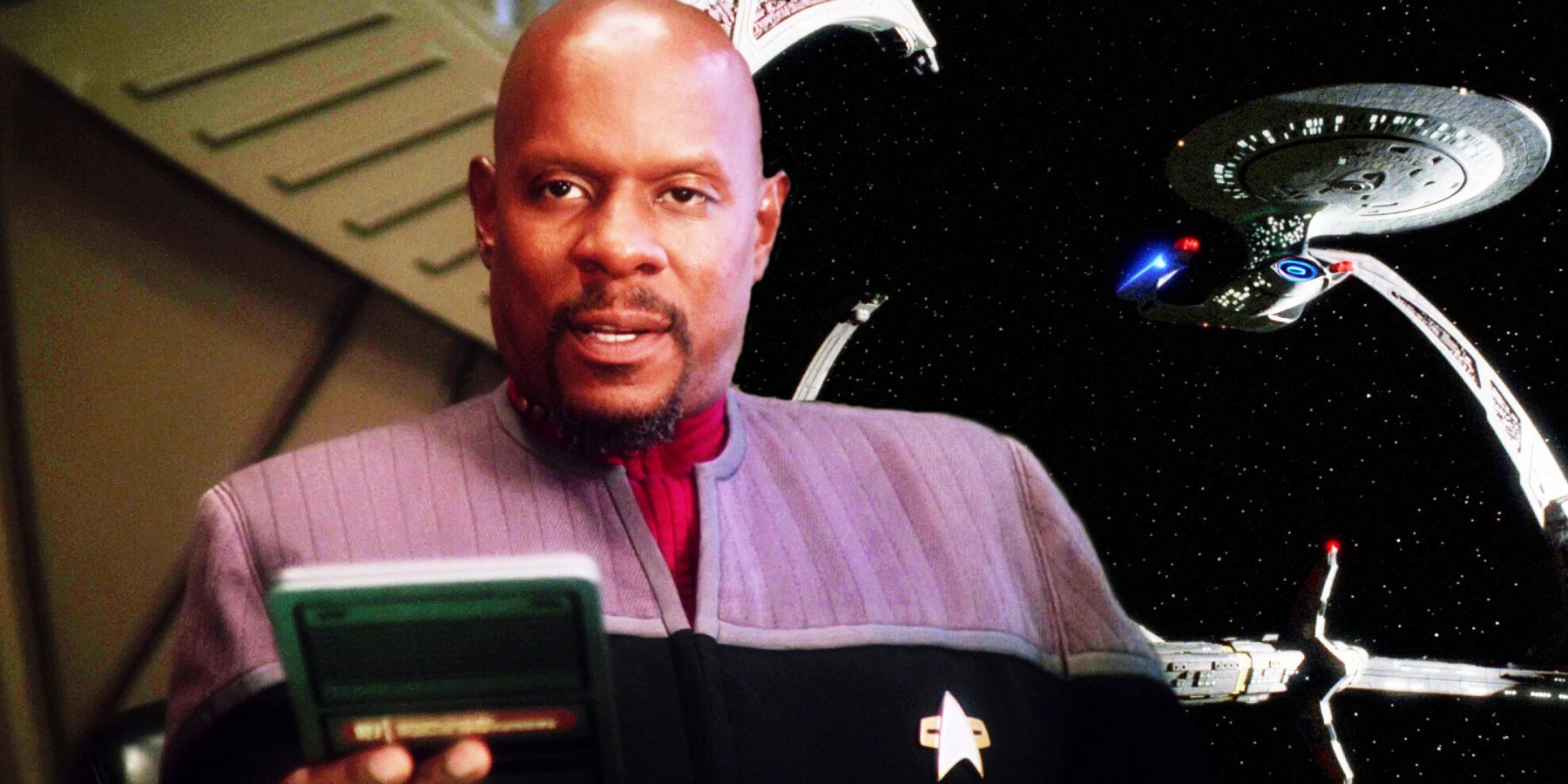 Sisko reads a PADD as the Enterprise is docked at DS9