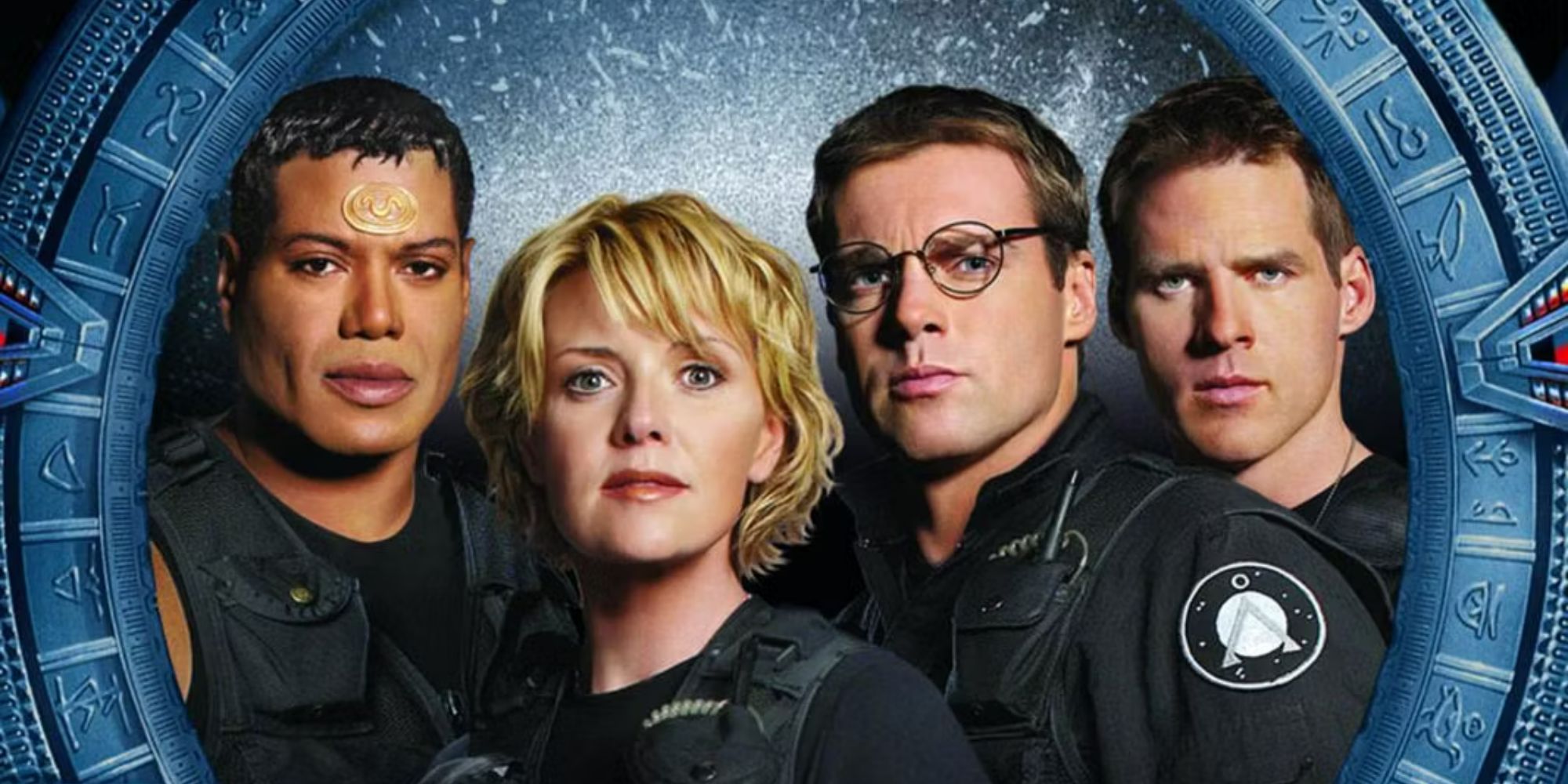 Teal'c (Christopher Judge), Samantha Carter (Amanda Tapping), Jack O'Neill (Richard Dean Anderson), and Daniel Jackson (Michael Shanks) in a promotional image for Stargate SG-1