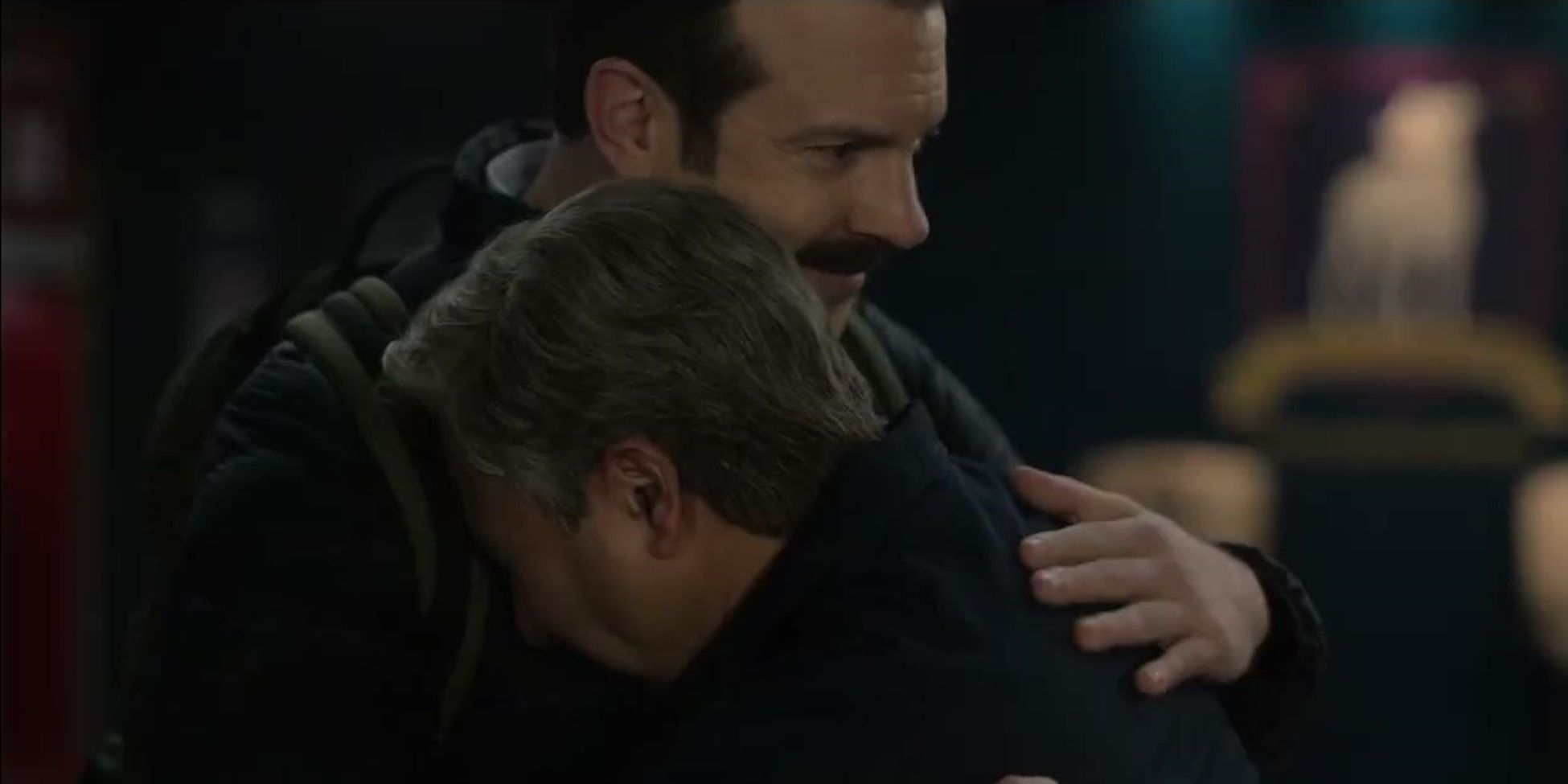 Ted hugs Nate in Ted Lasso