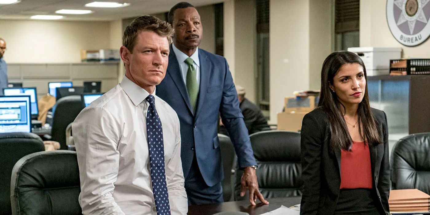 Peter, Mark and Anna in an office looking at something in Chicago Justice