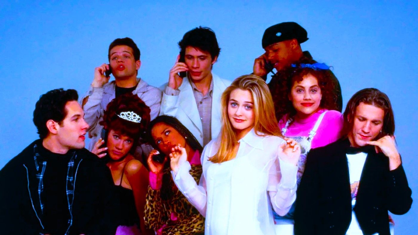 The cast of Clueless, many on their phones, posing