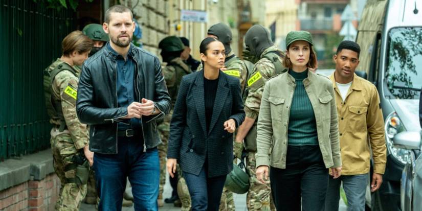 Luke, Cameron, Jamie and Andre walking outside in FBI International 