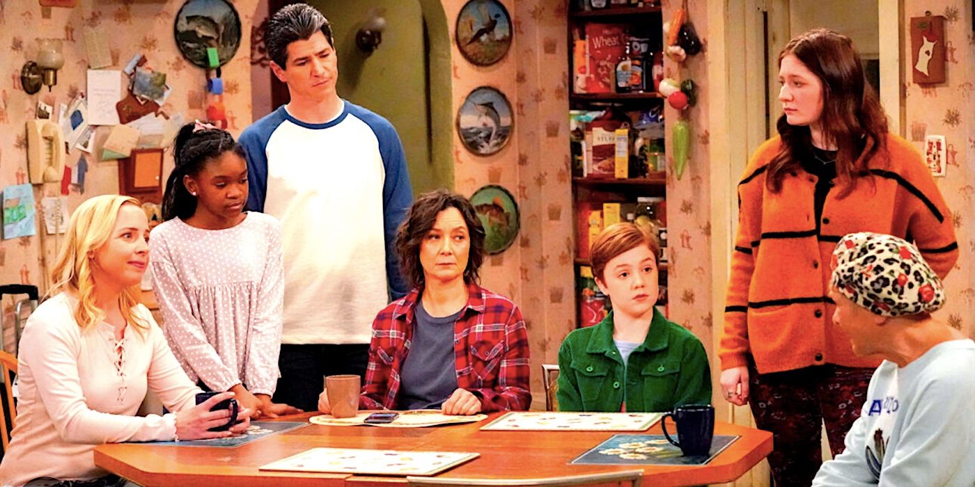 The Conner family sit at the kitchen table staring at Estelle Parsons' Beverly in The Conners season 2