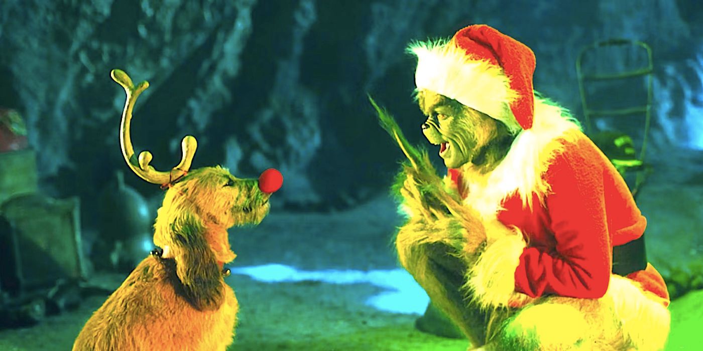 The Grinch grins at his dog Max dressed as a reindeer in How The Grinch Stole Christmas 2000