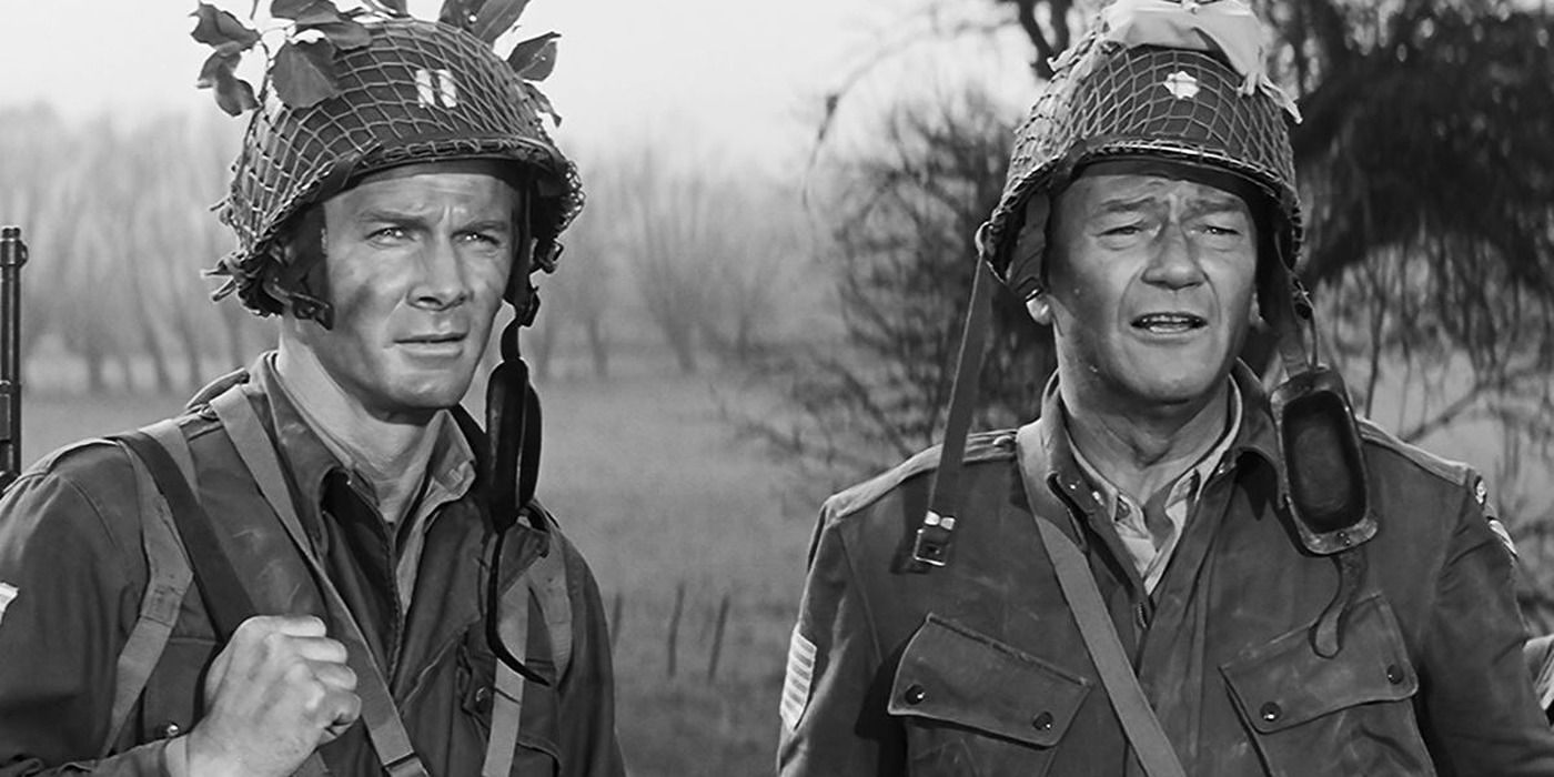 John Wayne as Lieutenant Col. Benjamin H. Vandervoort with another soldier in The Longest Day