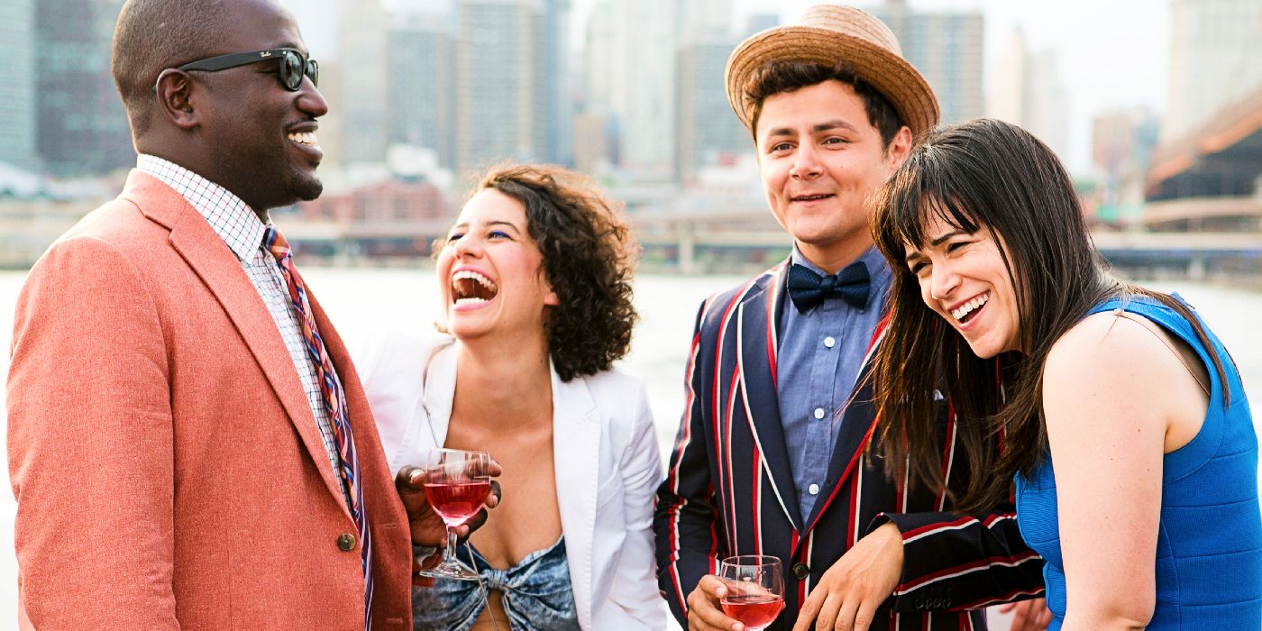 The main characters of Broad City laughing