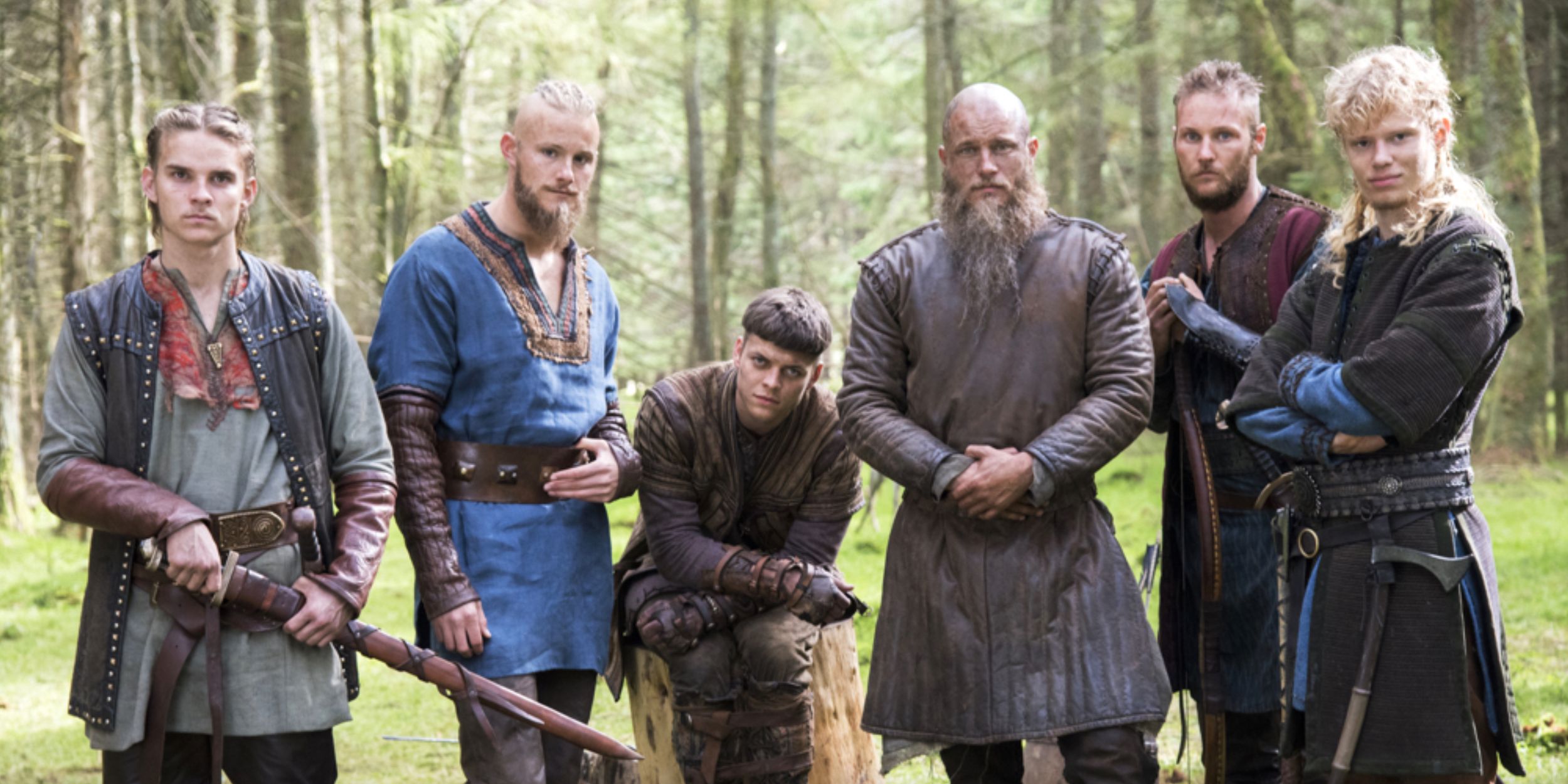 The Ragnar Family In Front Of A Tree Line In A Promotional Image For Vikings 