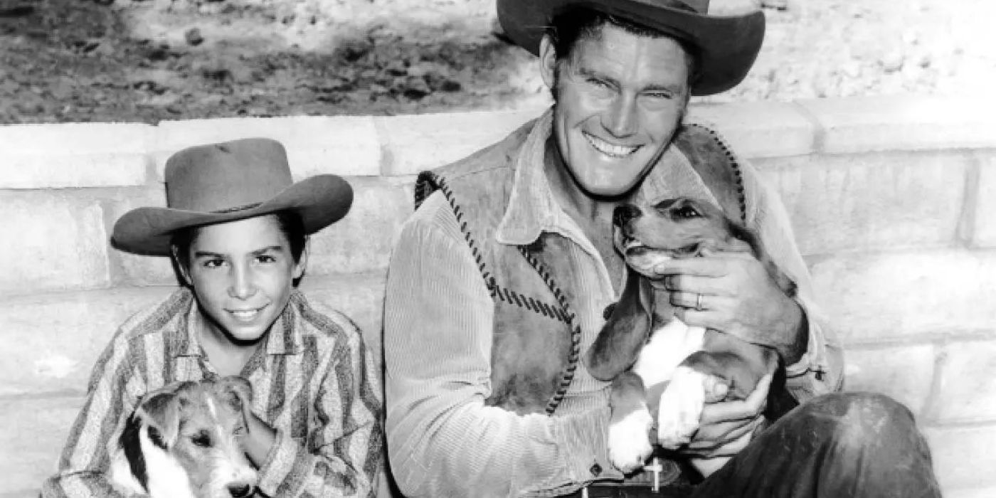 Chuck Connors and Johnny Crawford as Lucas and Mark McCain in The Rifleman