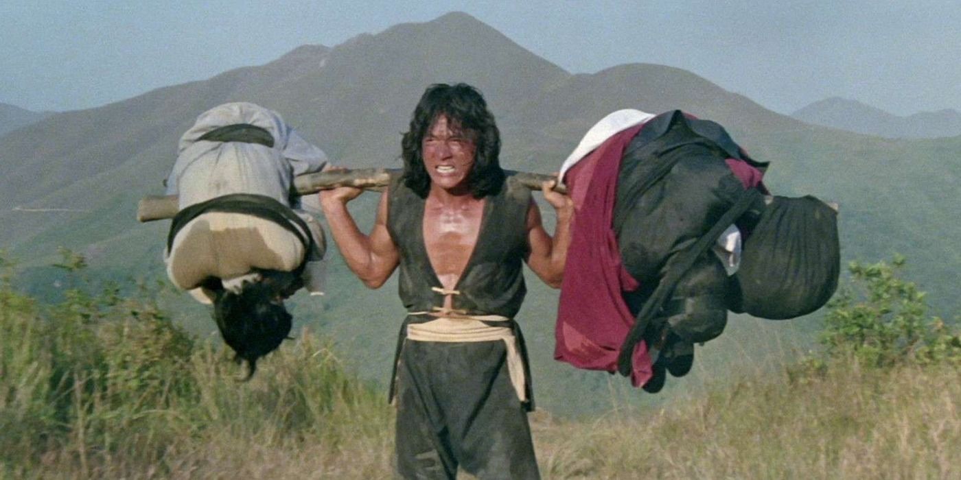 The Young Master Jackie Chan training with weights on his shoulders 