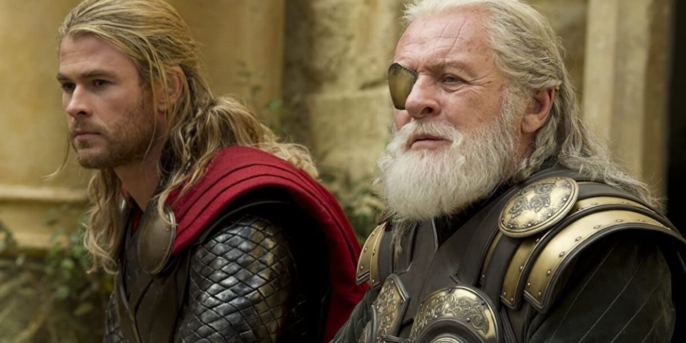 Thor (Chris Hemsworth) and Odin (Anthony Hopkins) sitting together in Thor: The Dark World