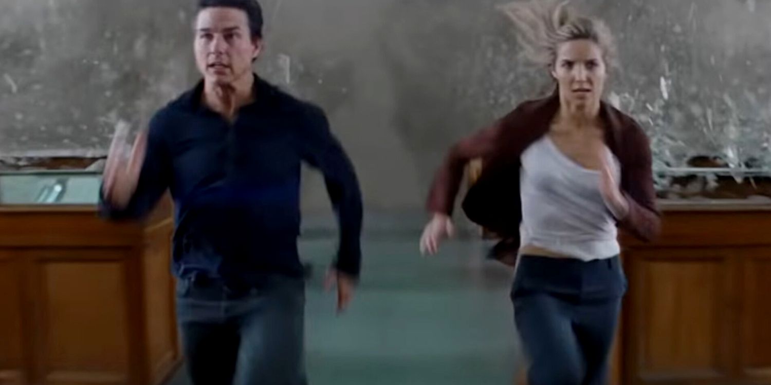 Tom Cruise and Annabelle Wallis running from a destructive force in The Mummy