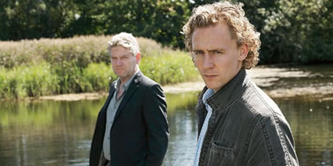 Kenneth Branagh and Tom Hiddleston looking at the camera by a pond in Wallander