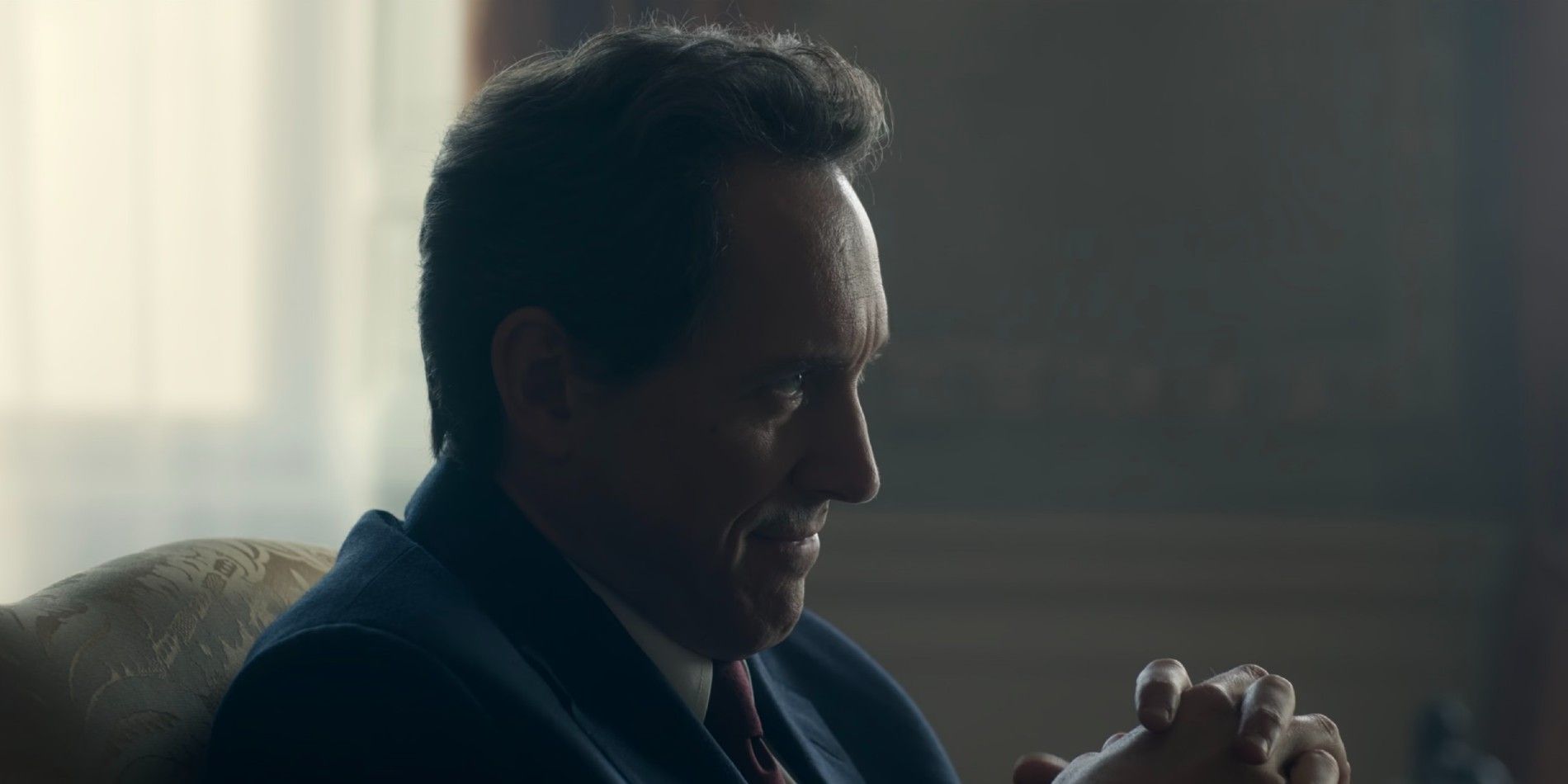 Tony Balir (Bertie Carvel) sits with his hands clasped in The Crown season 6