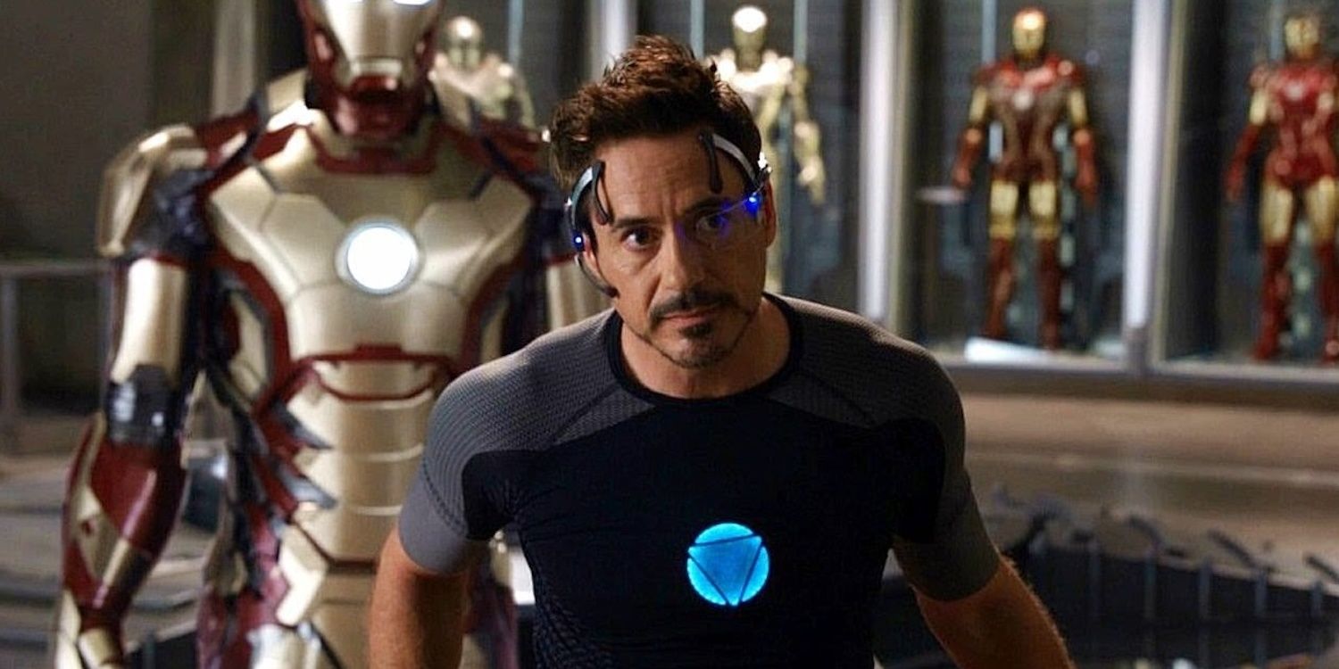 Robert Downey Jr. as Tony Stark surrounded by Iron Man suits
