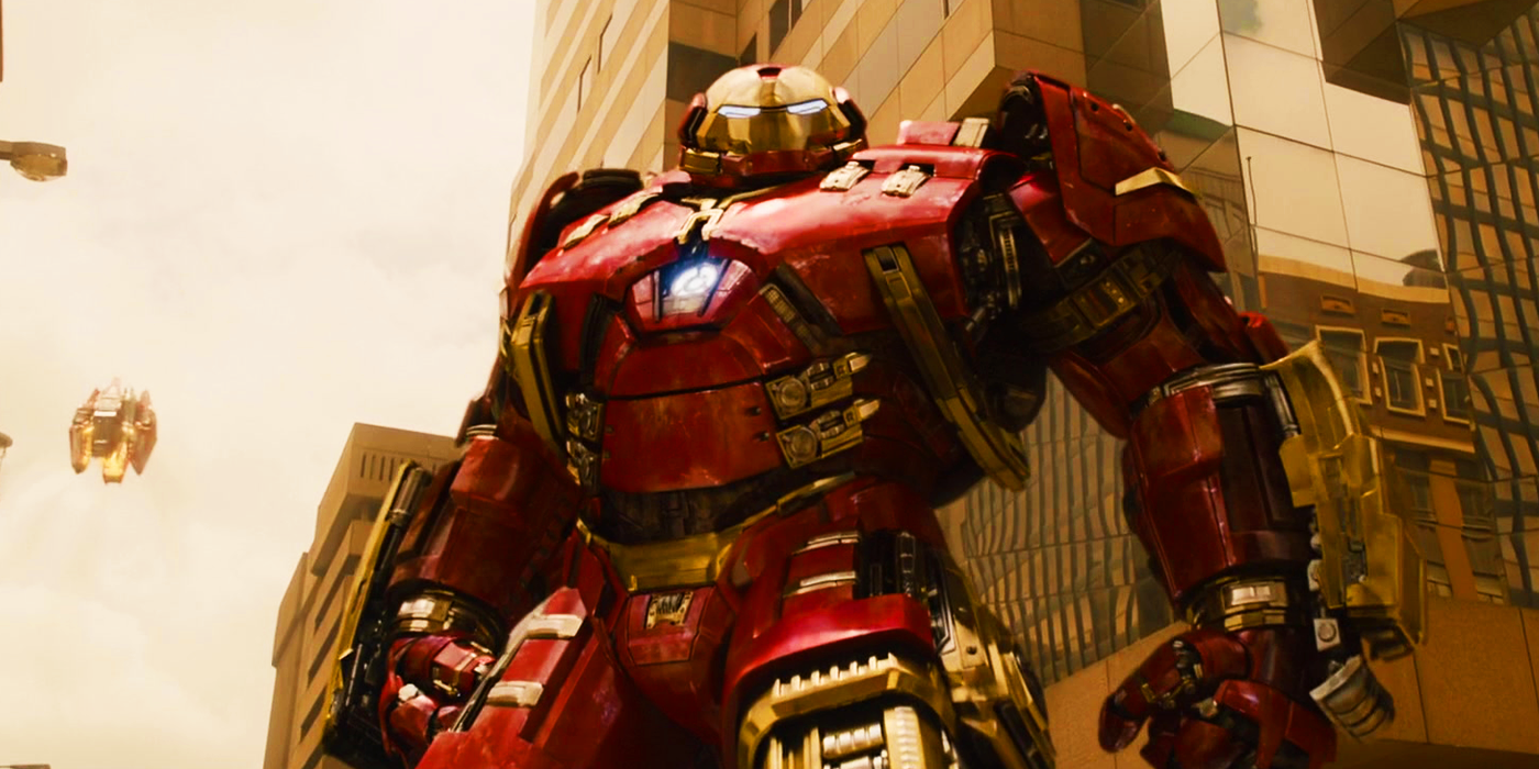 Tony Stark's Hulkbuster armor with Veronica in the background in Avengers Age of Ultron