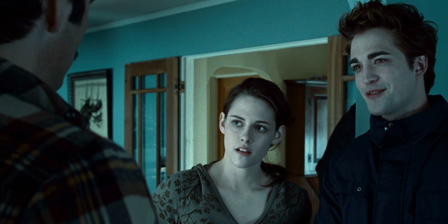 Edward and Bella stand together looking at Charlie in Twilight