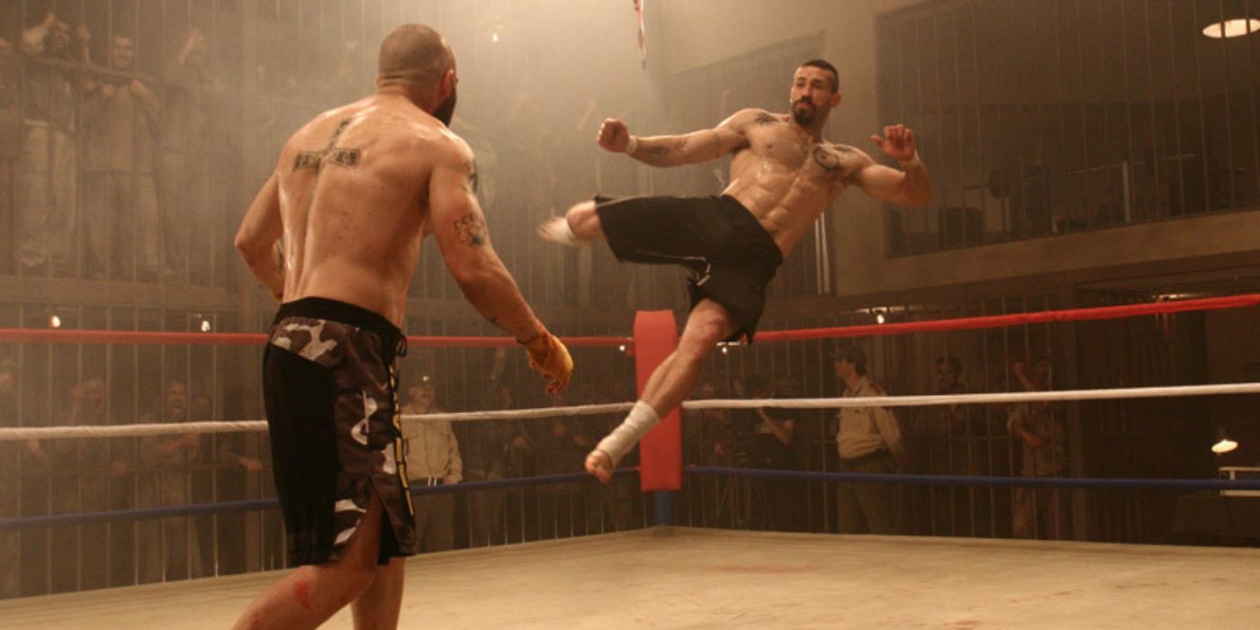 Yuri Boyka in mid-air launching a devastating flying kick to his opponent inside a kickboxing ring in Undisputed III: Redemption