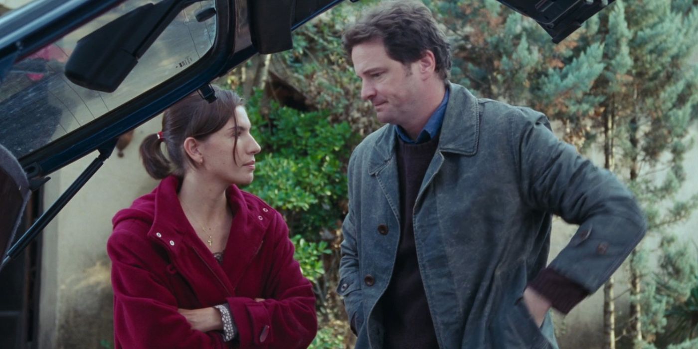 Colin Firth as Jamie Bennett stands outside a car with Lúcia Moniz as Aurelia in Love Actually