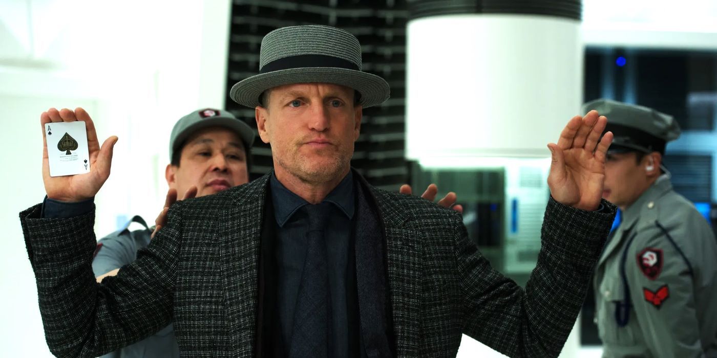 Woody Harrelson As Merritt holds up his hands and showing an Ace of Spaces in Now You See Me 2