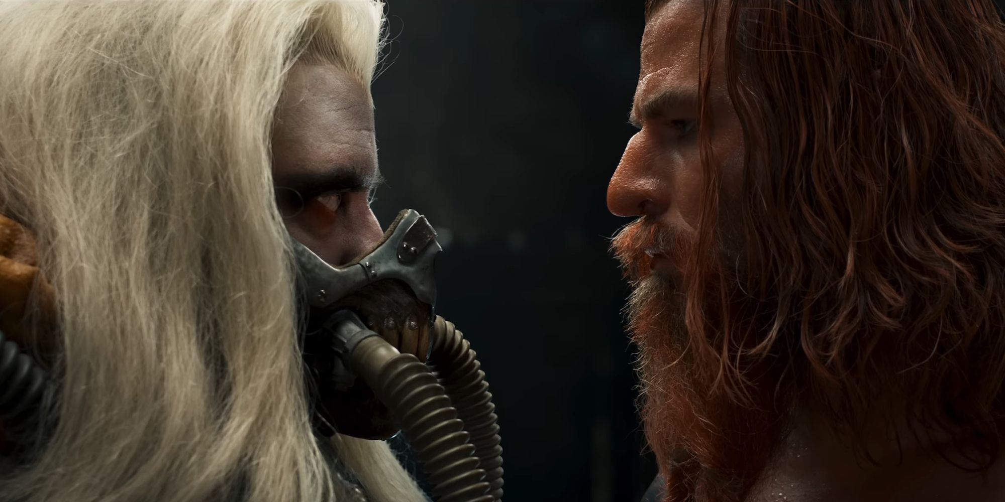 A close up shot of a young Immortan Joe facing off against an intense Dementus in Furiosa: A Mad Max Saga