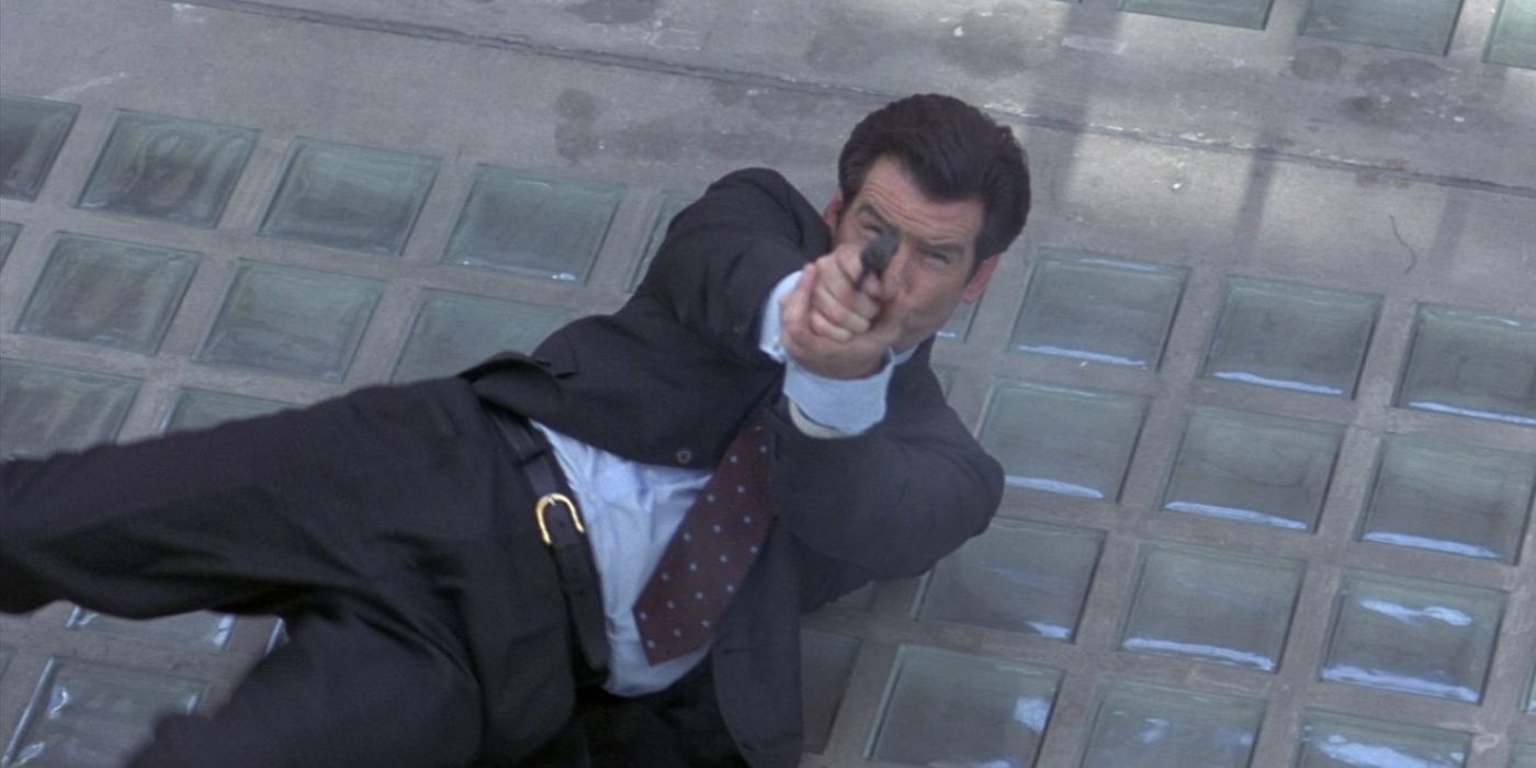 A Well-Dressed James Bond (Pierce Brosnan) Lies on His Back and Aims His Walther PPK Directly at the Camera in Tomorrow Never Dies