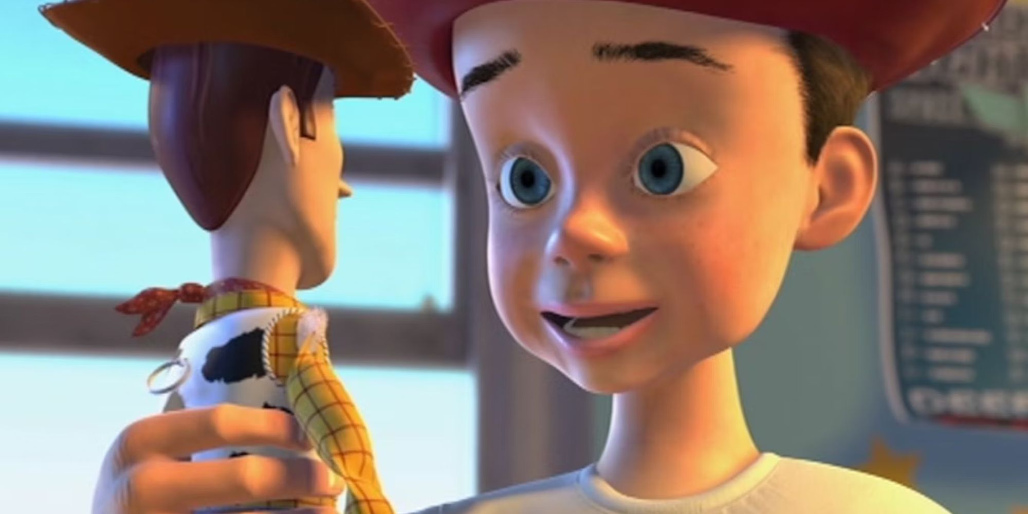 Andy Davis looking happily at Woody in Toy Story 2