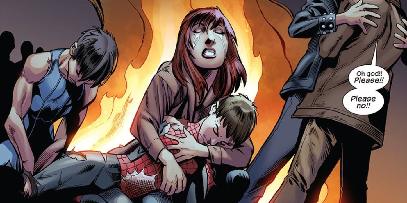 Mary Jane holding Spider-Man&rsquo;s dead body in her arms, crying.