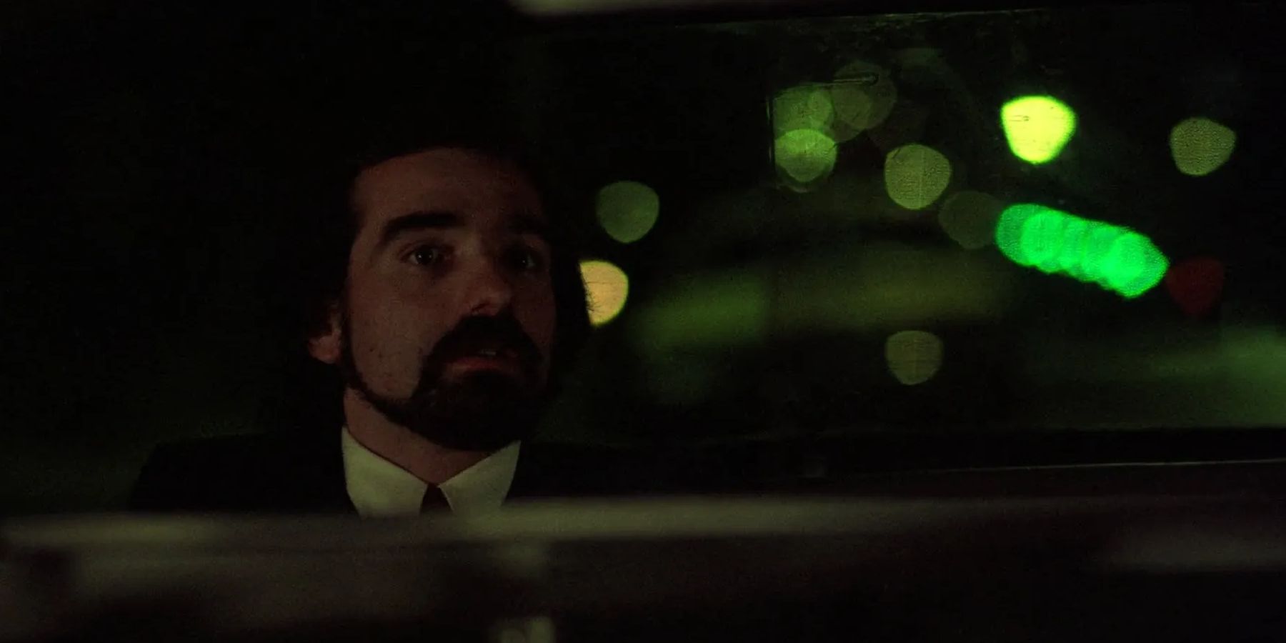Martin Scorsese sitting in the back of a cab in Taxi Driver