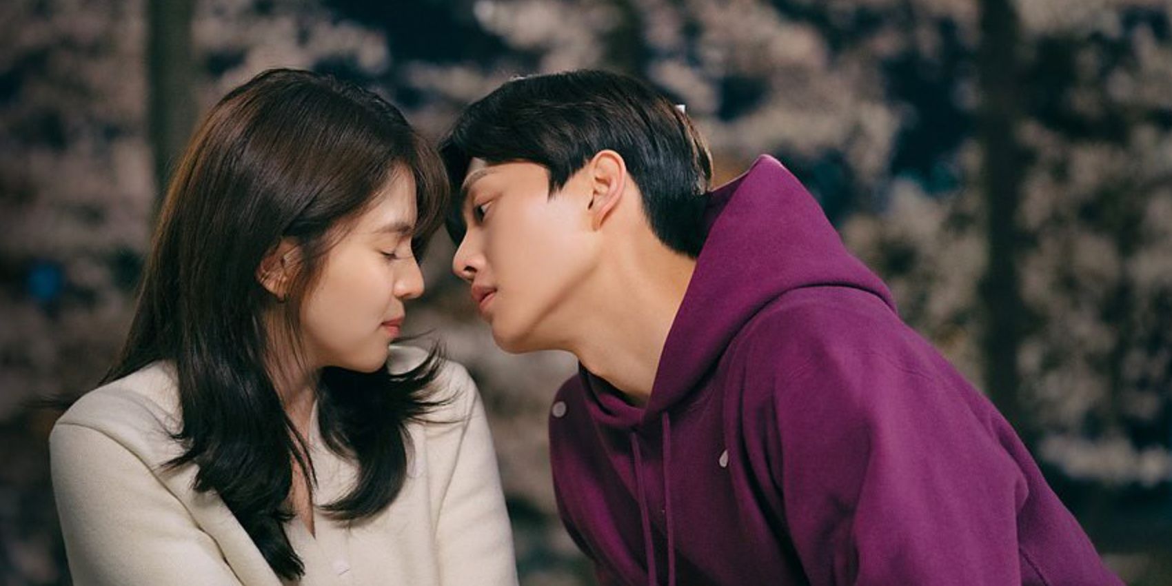 A man leaning in to kiss a woman in the K-drama Nevertheless