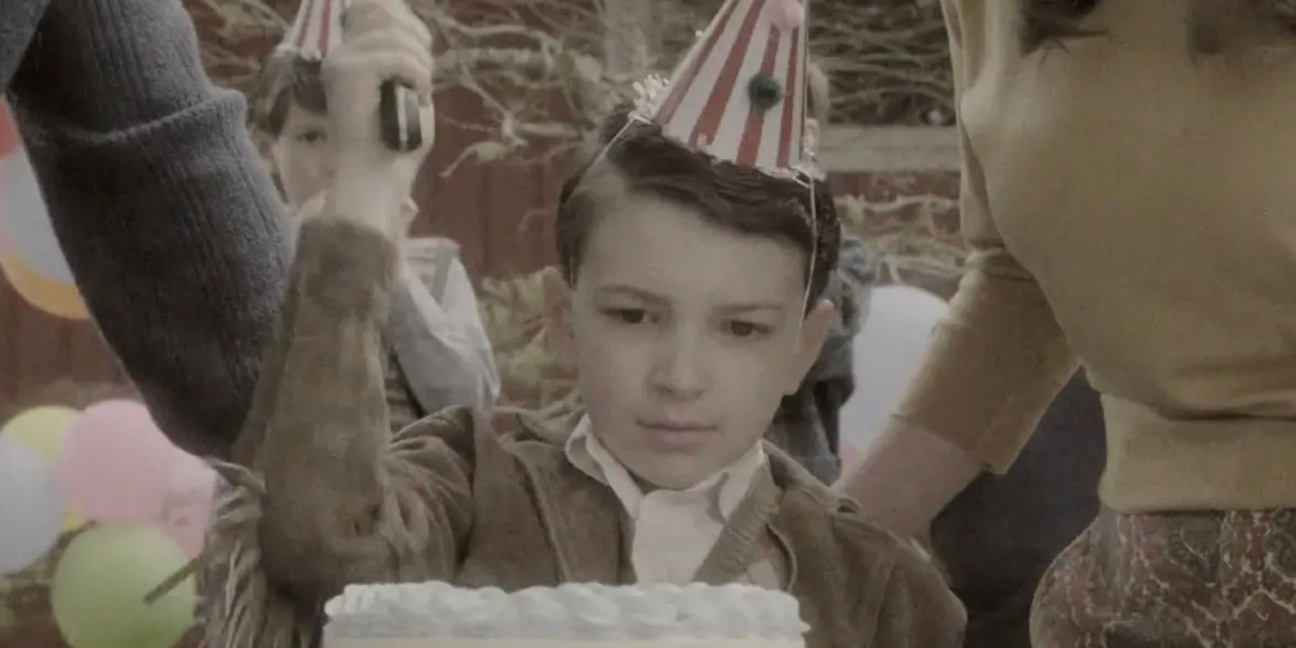 A young Charles Lee Ray using a knife on his cake in Chuckey season 1 flashback