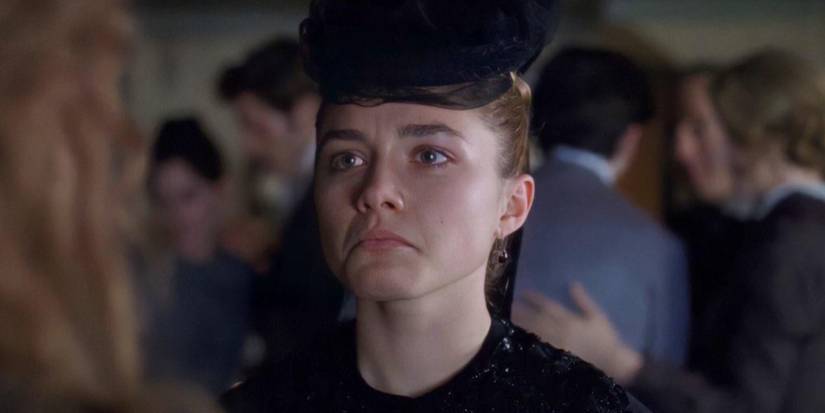 Amy March (Florence Pugh) dressed in black, frowning, in Little Women