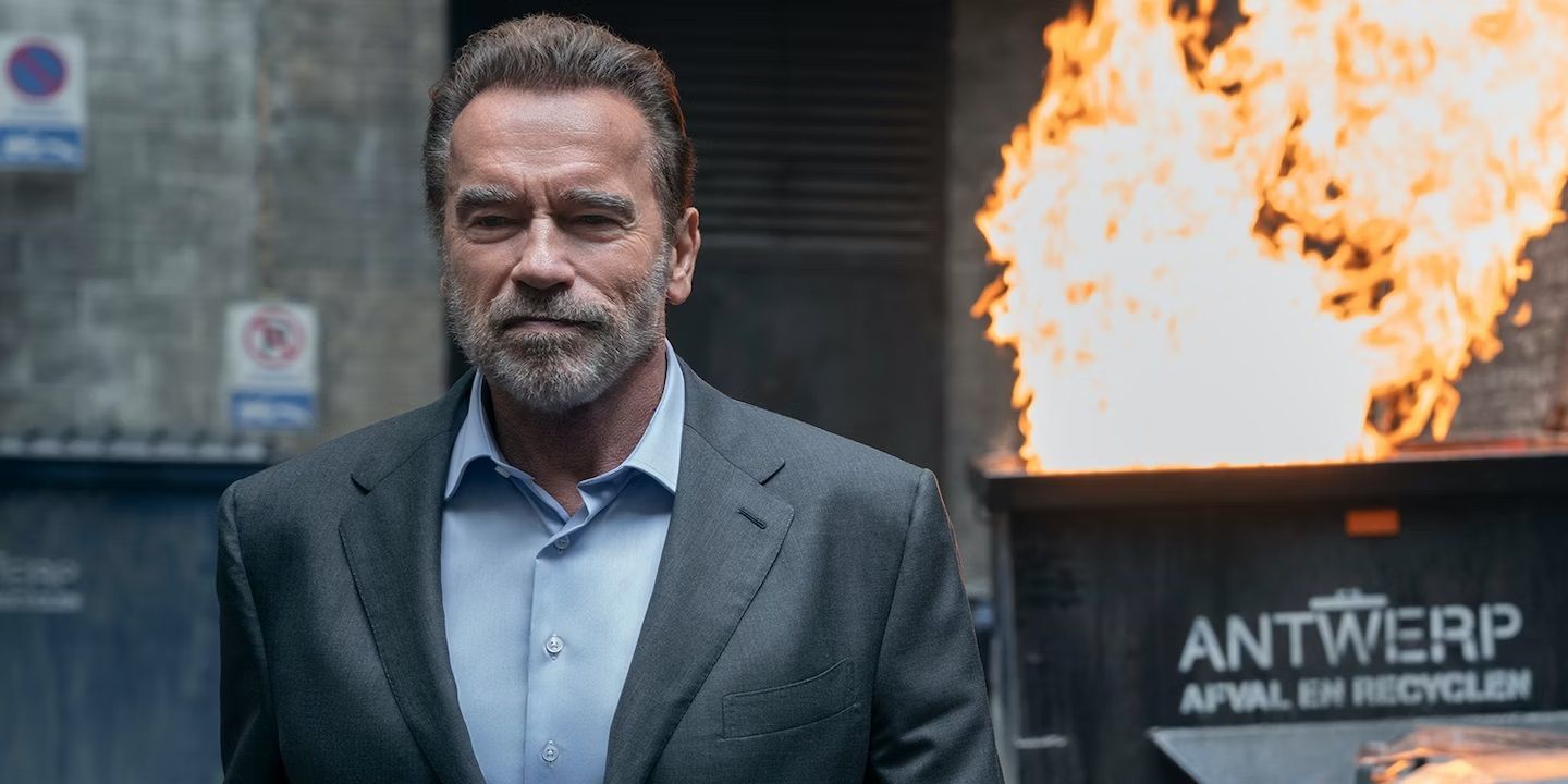 Arnold Schwarzenegger walking away from a dumpster fire in FUBAR