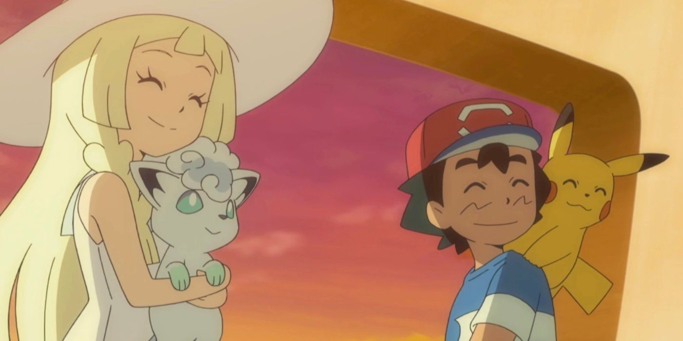 A girl with blonde hair holds a white fox-like creature and smiles while a boy wearing a red hat with a yellow mouse-like creature smiles as well. 