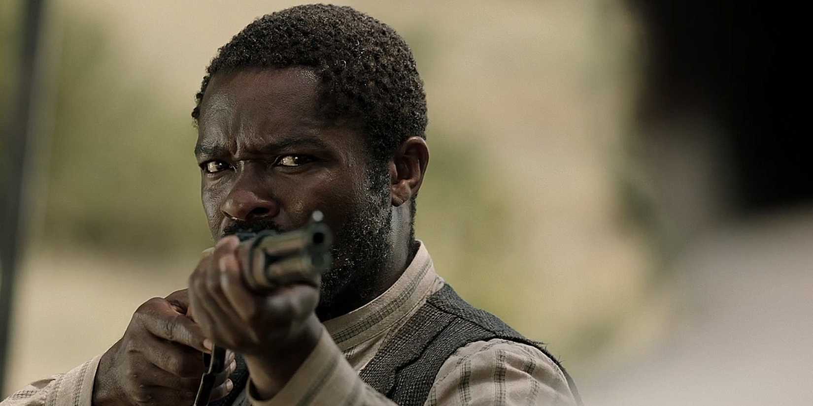 Bass Reeves (David Oyelowo) pointing a gun in Lawmen Bass Reeves episode 7