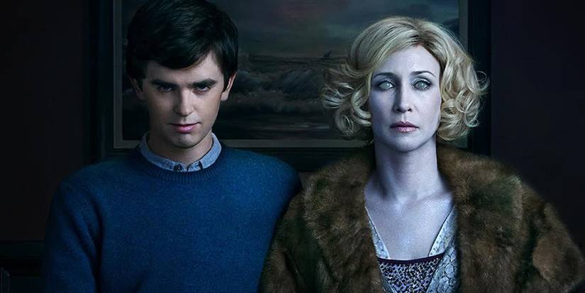 Freddie Highmore as Norman Bates and Vera Farmiga as Norma Louise Bates standing side-by-side in Bates Motel