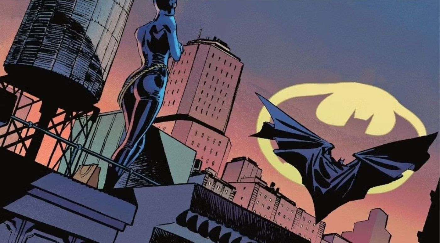 Comic book panel: Catwoman standing on a roof as Batman leaps away with the Bat-Signal in the distance.