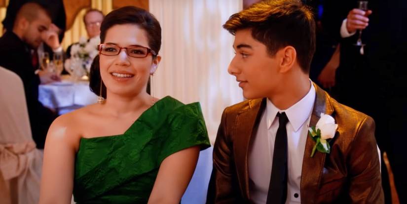 Betty and Justin sitting in formal wear in Ugly Betty