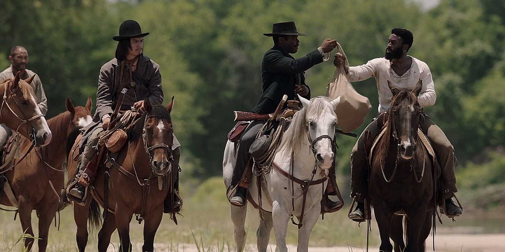 Billy Crow (Forrest Goodluck) and Jackson Cole (Tosin Morohunfola) riding on horses in Lawmen Bass Reeves finale