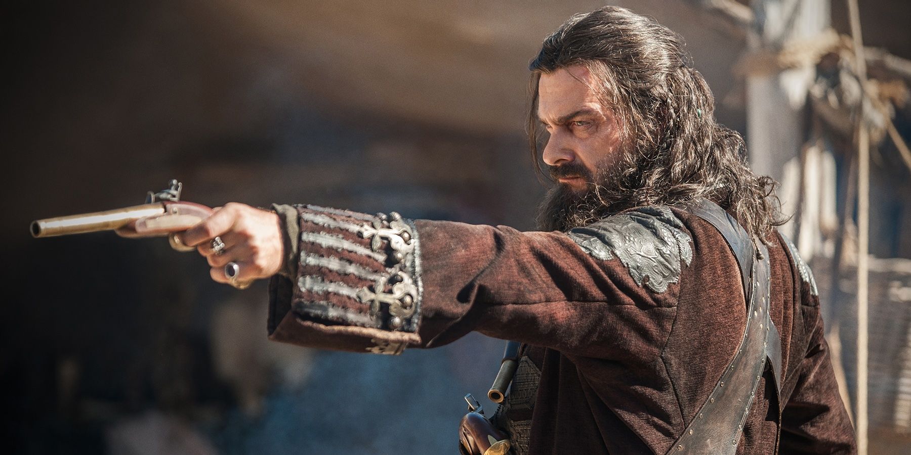 Blackbeard pointing a gun in Black Sails.