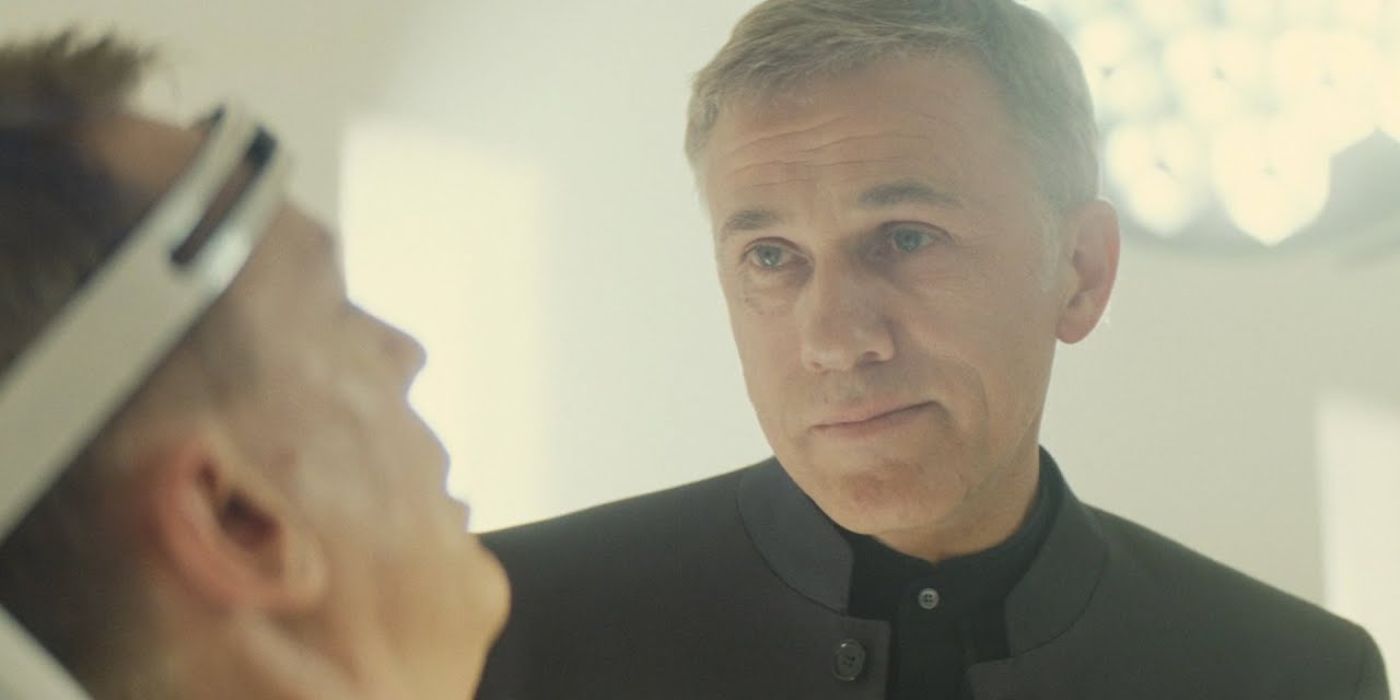 Blofeld from Spectre looking at Bond with a device around his head